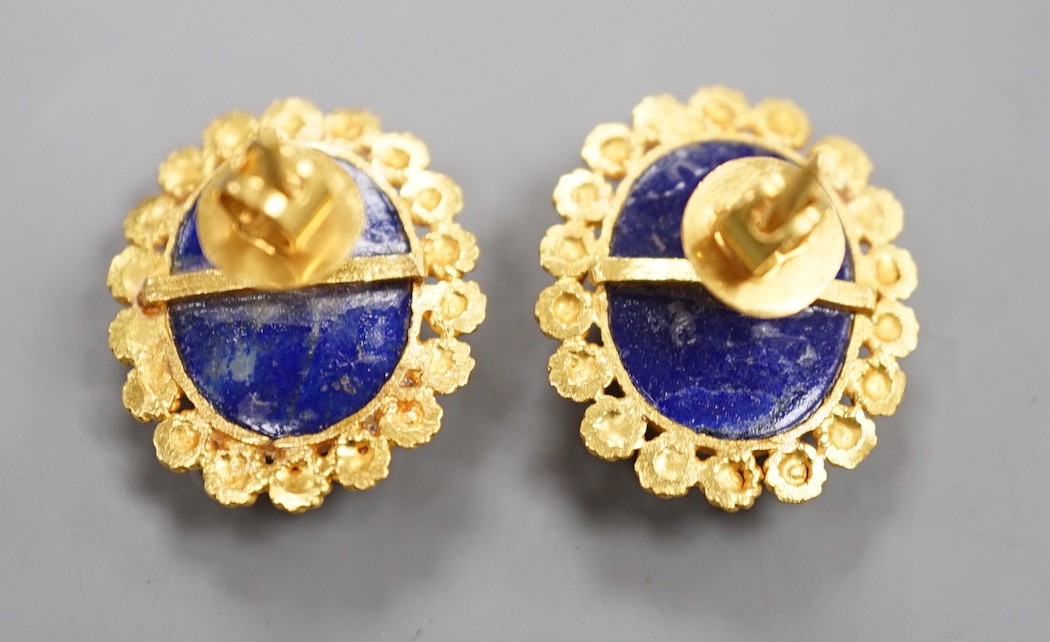 A pair of bright cut yellow metal and lapis lazuli set oval earrings, 20mm, gross weight 9.5 grams.